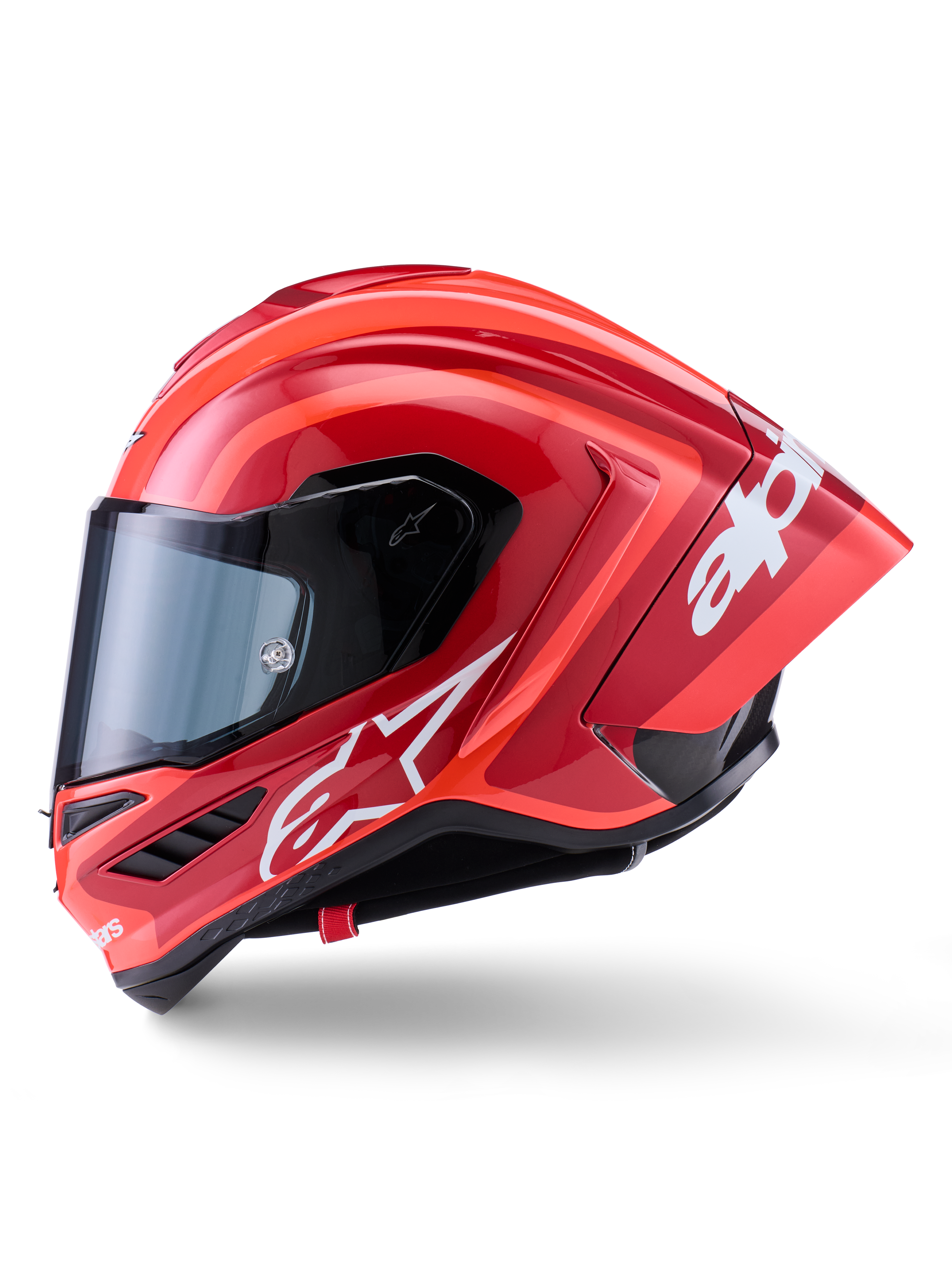 Alpinestars Supertech R10 Arius Helmet, Full-Face Racing Helmet, Glossy Red with white logo graphics, side profile view highlighting aerodynamic spoiler and clear visor, carbon fiber composite shell for professional motorsport