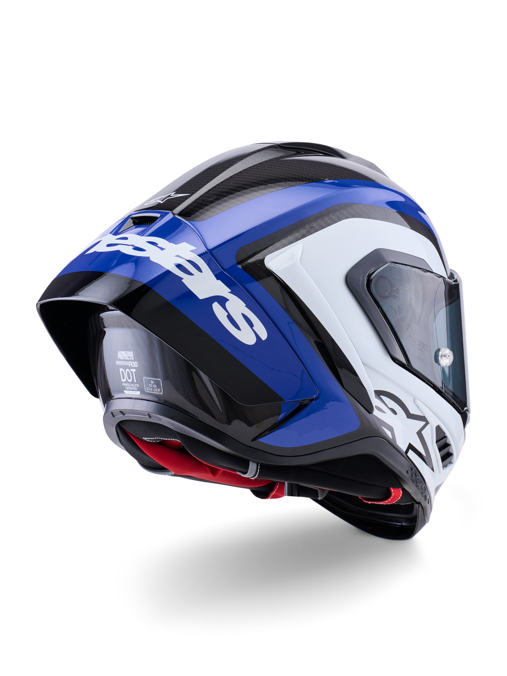 Casco Alpinestars Supertech R10 Arius, casco integral de competición, negro, blanco y azul brillante, vista trasera de tres cuartos que muestra el spoiler aerodinámico, textura de fibra de carbono visible y el logotipo de Alpinestars en blanco