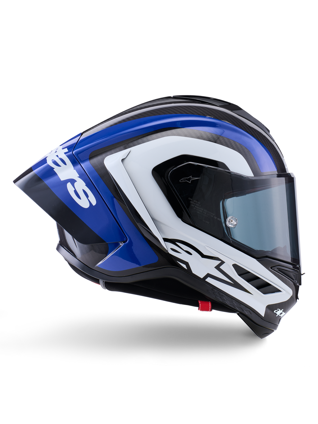 Casco Alpinestars Supertech R10 Arius, casco integral de competición, acabado brillante en negro, blanco y azul, vista lateral aerodinámica que muestra la calota de fibra de carbono y un gran alerón trasero con el logo de Alpinestars, equipamiento de protección profesional para motociclismo