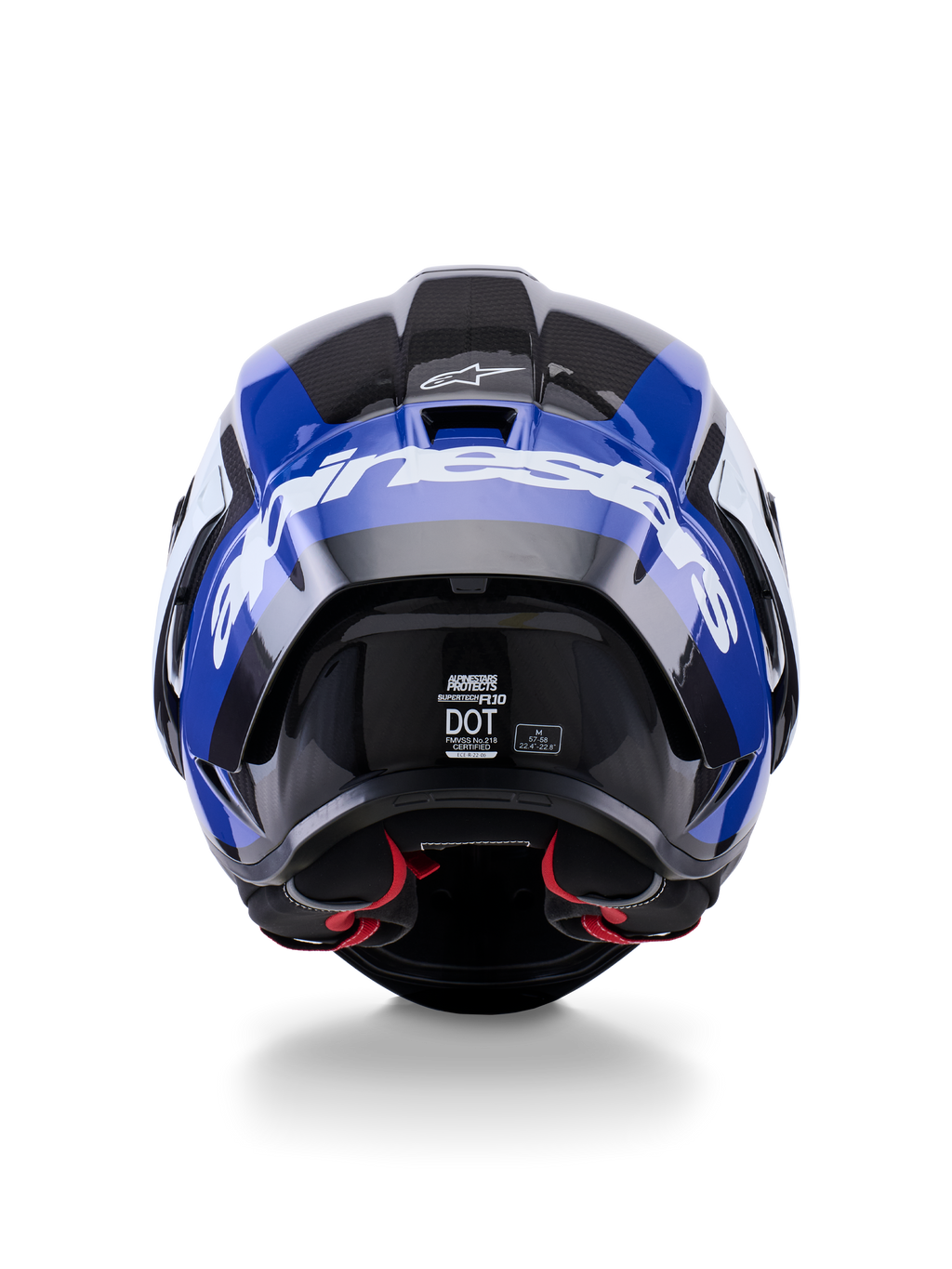 Casco Alpinestars Supertech R10 Arius, vista trasera, negro, blanco y azul brillante, construcción en fibra de carbono con logotipo blanco prominente, forma aerodinámica, etiqueta con certificación DOT y acolchado interior rojo