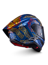 Casco Alpinestars Supertech R10 Martinator Thai, azul brillante con mandalas dorados y spoiler trasero aerodinámico.