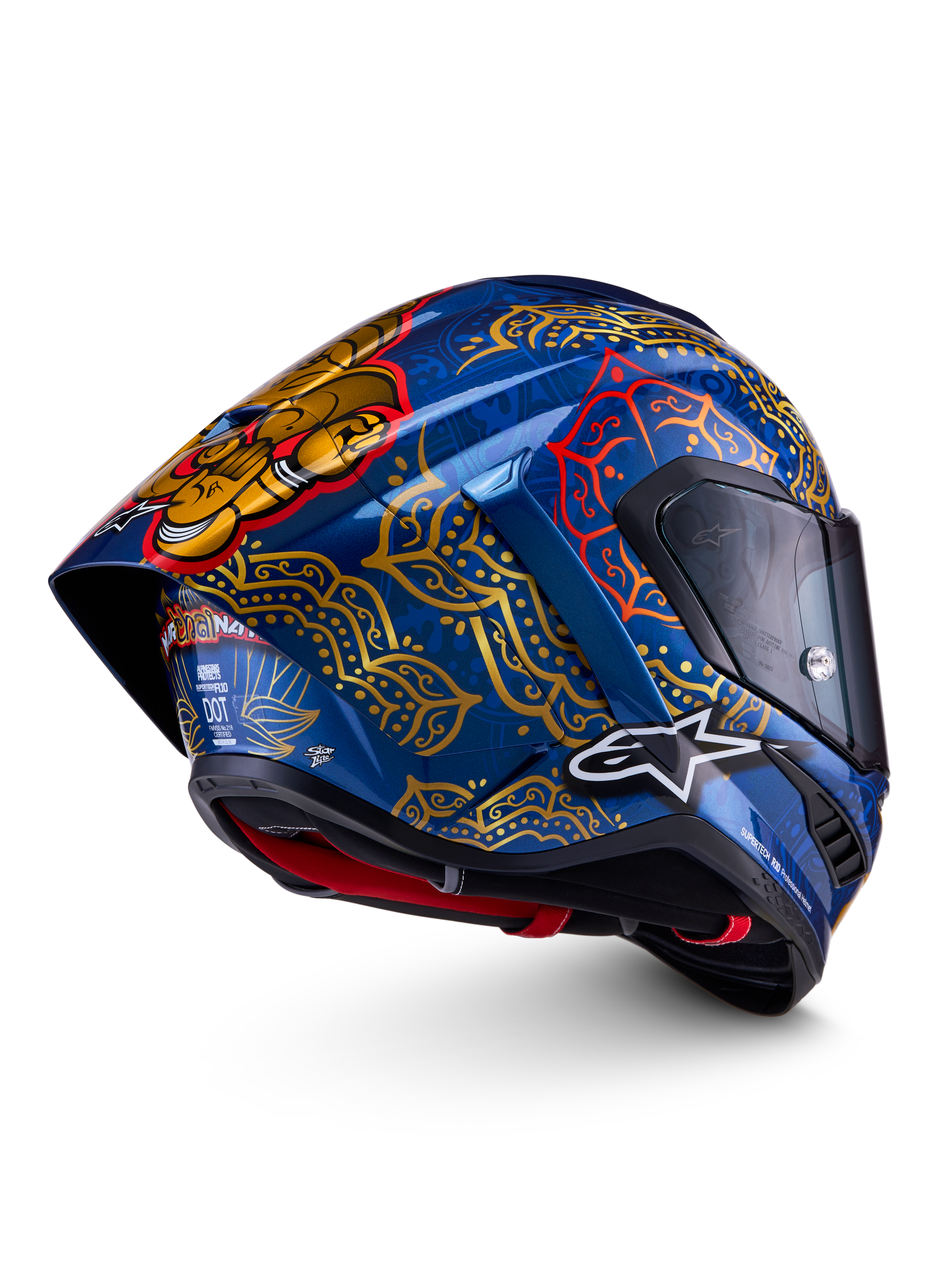 Casco Alpinestars Supertech R10 Martinator Thai, azul brillante con mandalas dorados y spoiler trasero aerodinámico.