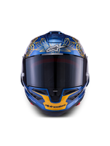 Casco Alpinestars Supertech R10 Martinator Thai LE de fibra de carbono azul y dorado con visor ahumado frontal.