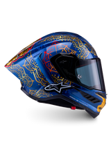 Casco Supertech R10 Martinator Thai en carbono azul brillante con mandalas dorados y perfil de competición.