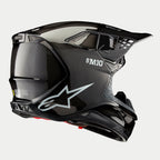 Casco Alpinestars Supertech M10 Solid, casco de motocross, acabado de carbono negro brillante, con el logotipo blanco de Astars y la marca S-M10, calota aerodinámica con tejido de fibra de carbono visible y múltiples puertos de ventilación