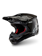 Alpinestars Supertech M10 Solid ECE 22.06, casco de motocross negro de carbono brillante, con visera de pico y forro interior rojo, vista de tres cuartos
