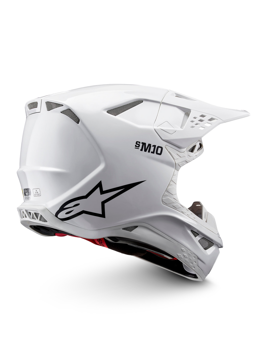 Alpinestars Supertech M10 Solid ECE 22.06, casco de motocross blanco brillante con gráficos negros, detalles rojos, puertos de ventilación y visor de pico