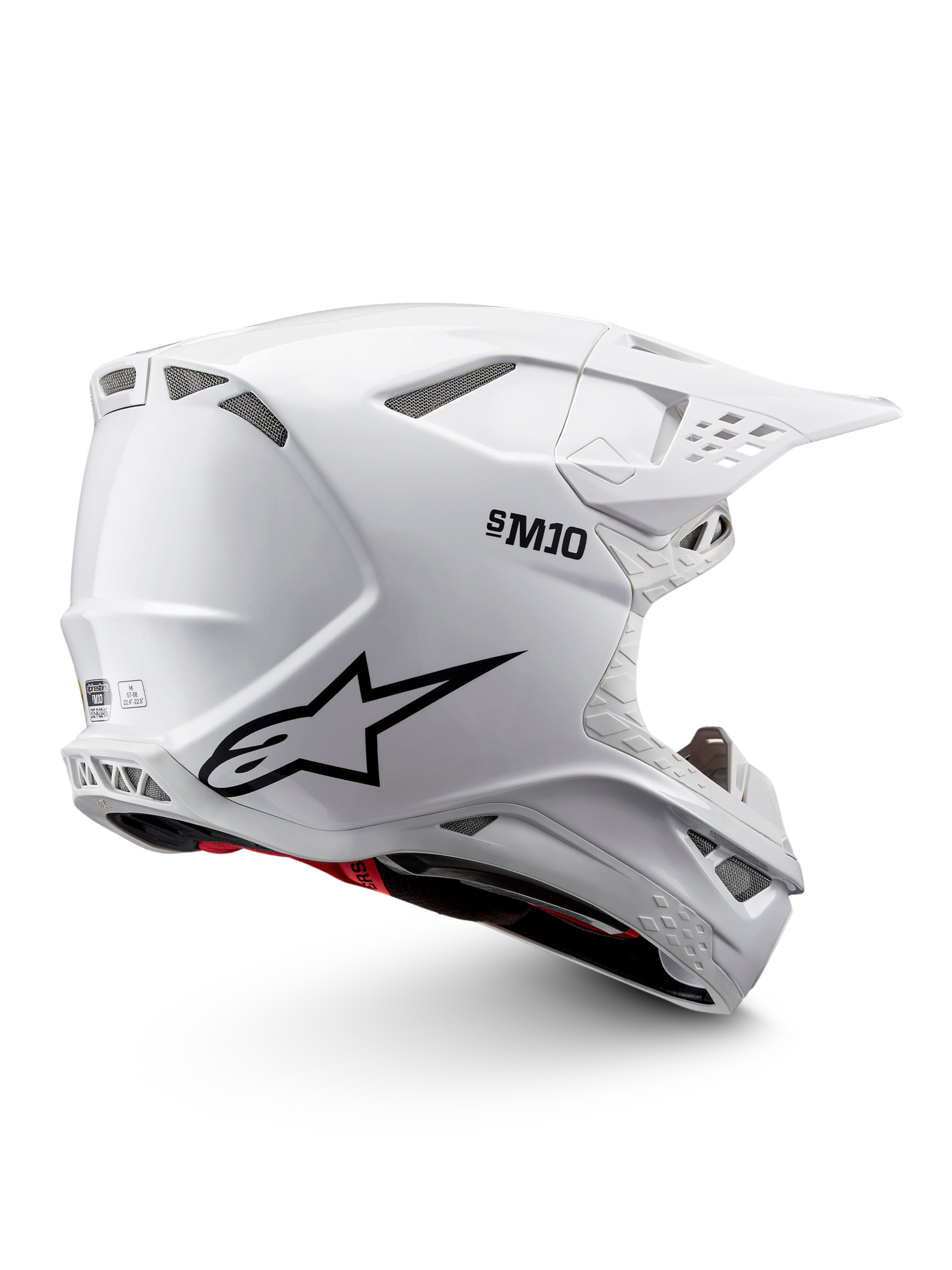 Alpinestars Supertech M10 Solid ECE 22.06, casco de motocross blanco brillante con gráficos negros, detalles rojos, puertos de ventilación y visor de pico