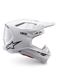 Alpinestars Supertech M10 Solid ECE 22.06, casco de motocross blanco brillante con logotipo negro, visera de pico y diseño ventilado, vista lateral