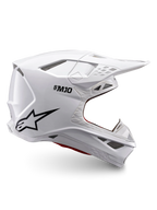 Alpinestars Supertech M10 Solid ECE 22.06, casco de motocross blanco brillante con logotipo negro, visera de pico y diseño ventilado, vista lateral