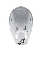Alpinestars Supertech M10 Solid ECE 22.06, casco de motocross blanco brillante, vista trasera con puertos de ventilación y logotipos Alpinestars negros, carcasa de carbono y aramida