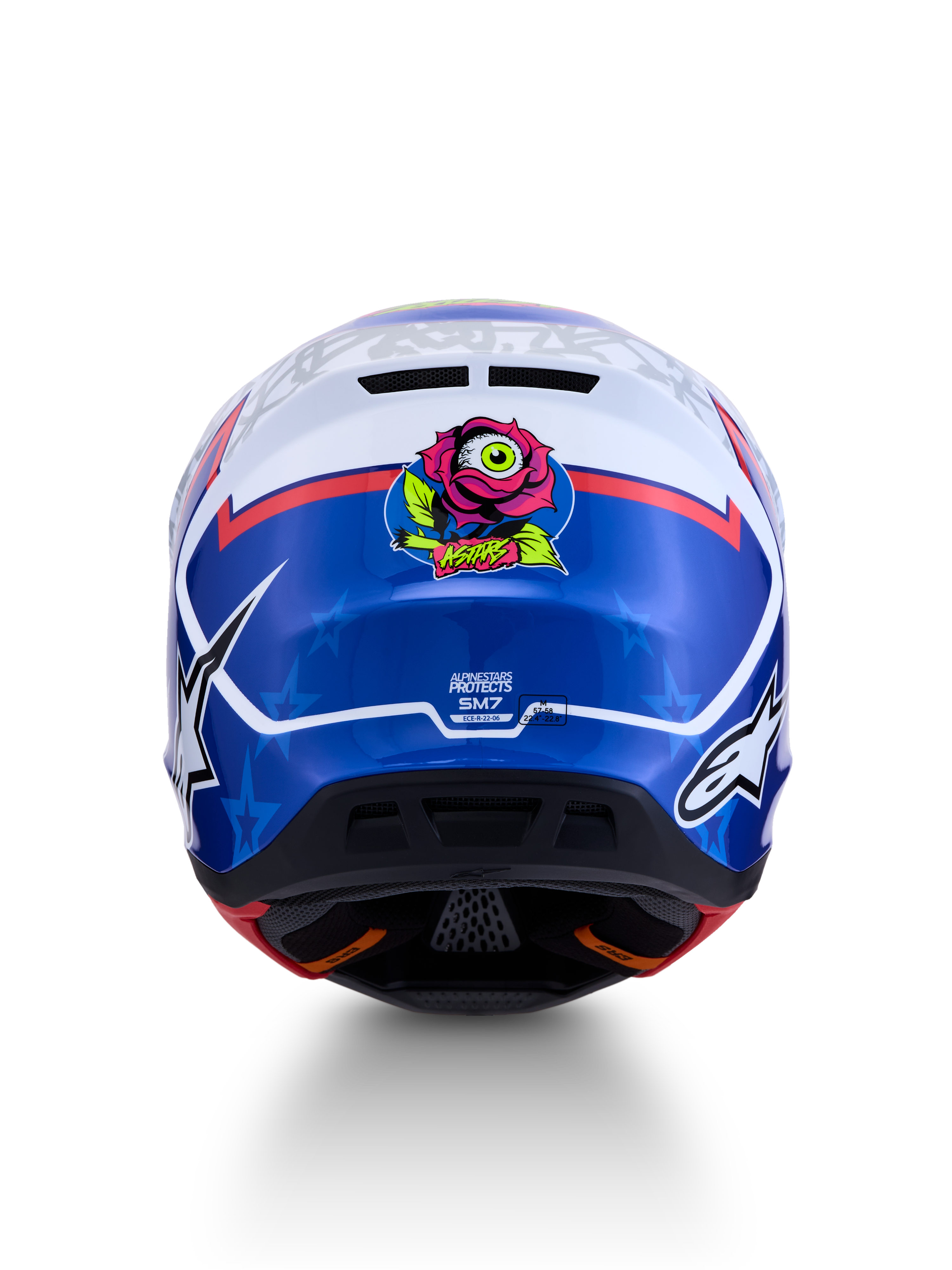 Alpinestars casco S-M7 Blaster ECE06, casco de motocross para hombre, azul y blanco, vista trasera con gráfico de rosa y ojo, certificación ECE 22.06 visible, diseño aerodinámico para off-road