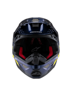 Casco Alpinestars Supertech M10 TLD Edition 25, casco de motocross, azul oscuro metálico brillante con acolchado interior rojo, vista frontal que muestra la malla de ventilación y gráficos laterales en amarillo y naranja, protección premium para carreras off-road.