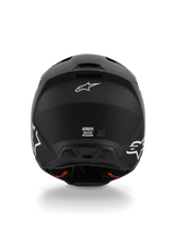 Casco Alpinestars S-M3 Solid ECE 22.06, casco de motocross, negro mate, vista trasera con logotipos Astar de Alpinestars en blanco, puertos de salida de ventilación en la base, acabado mate para carreras off-road