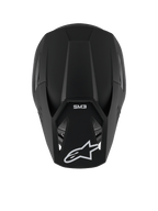Casco Alpinestars S-M3 Solid, casco de motocross, negro mate, vista desde arriba que muestra la textura mate y la carcasa aerodinámica, con el logotipo de la estrella de Alpinestars en blanco en la visera y la marca SM3, protección premium para la cabeza en competiciones off-road