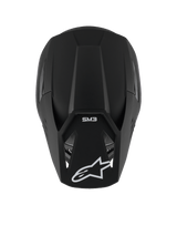 Casco Alpinestars S-M3 Solid, casco de motocross, negro mate, vista desde arriba que muestra la textura mate y la carcasa aerodinámica, con el logotipo de la estrella de Alpinestars en blanco en la visera y la marca SM3, protección premium para la cabeza en competiciones off-road