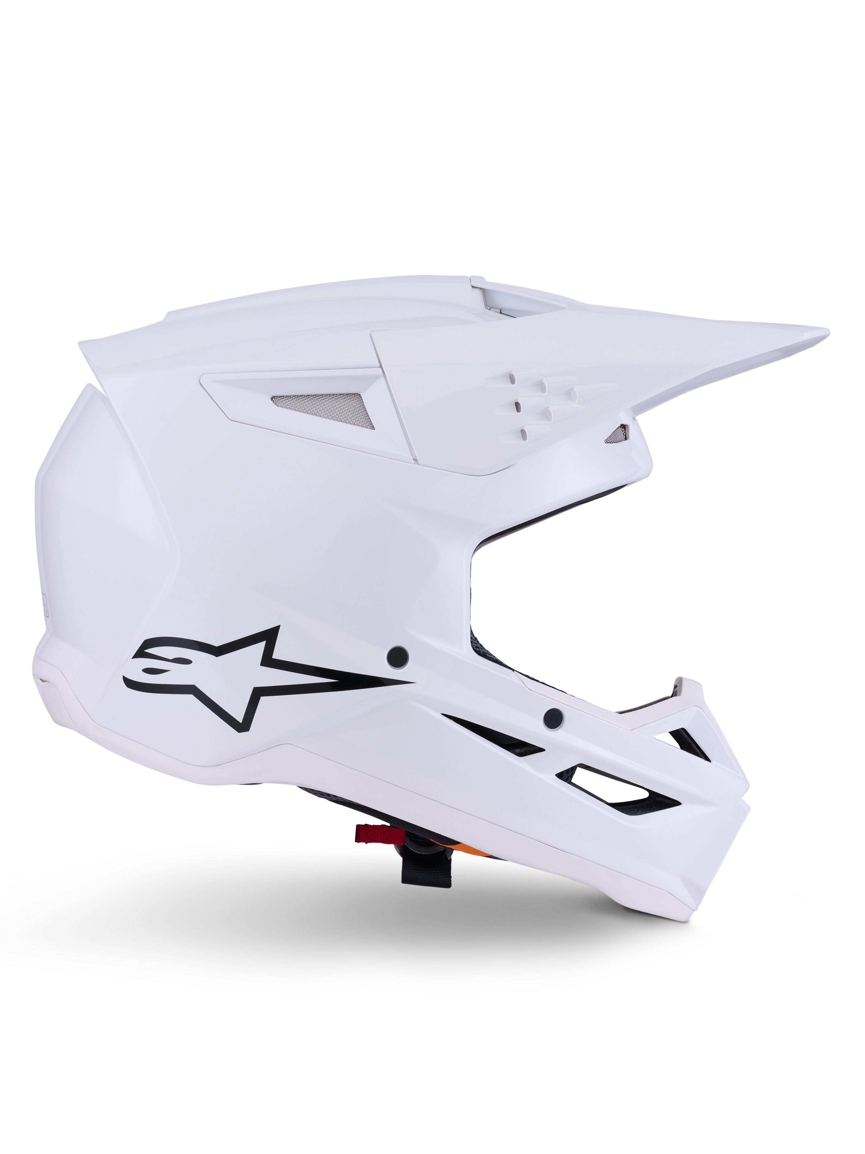 Casco Alpinestars S-M3 Solid, casco de motocross, blanco brillante, vista de perfil lateral con logo de estrella negra, carcasa aerodinámica angular, múltiples puertos de ventilación, visera y mentonera integradas, protección para carreras off-road