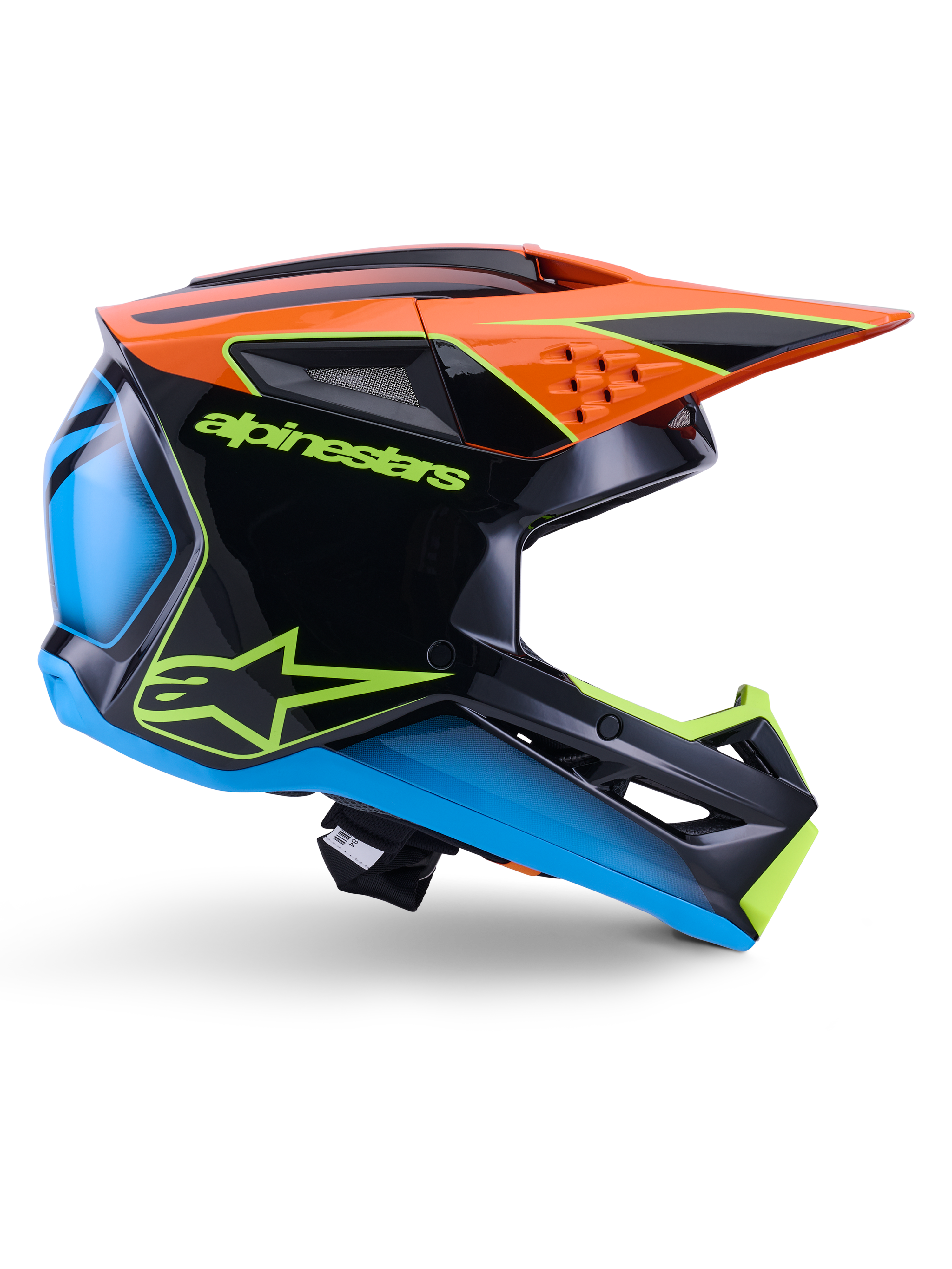Alpinestars S-M3 Fray Helmet ECE 22.06, casco de motocross, negro, naranja, azul y amarillo neón, perfil lateral de una calota aerodinámica brillante con una visera naranja prominente, logotipos en verde neón y detalles en azul, protección para carreras todoterreno