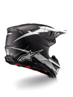 Casco Alpinestars Supertech M10 Ampress, casco de motocross, negro y blanco mate, con llamativos gráficos de rayos blancos sobre una calota negra mate, vista trasera de tres cuartos que muestra el logotipo de Alpinestars y los puertos de ventilación