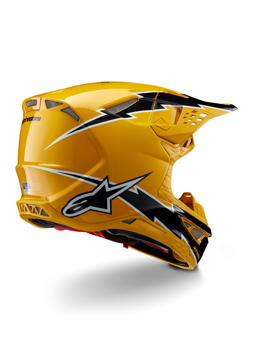 Casco Alpinestars Supertech M10 Ampress, casco de motocross, negro y amarillo brillante, con un acabado amarillo de alto brillo y gráficos estilo rayo en blanco y negro, vista trasera de tres cuartos que muestra la calota aerodinámica y puertos de ventilación integrados