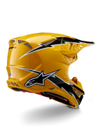 Casco Alpinestars Supertech M10 Ampress, casco de motocross, negro y amarillo brillante, con un acabado amarillo de alto brillo y gráficos estilo rayo en blanco y negro, vista trasera de tres cuartos que muestra la calota aerodinámica y puertos de ventilación integrados
