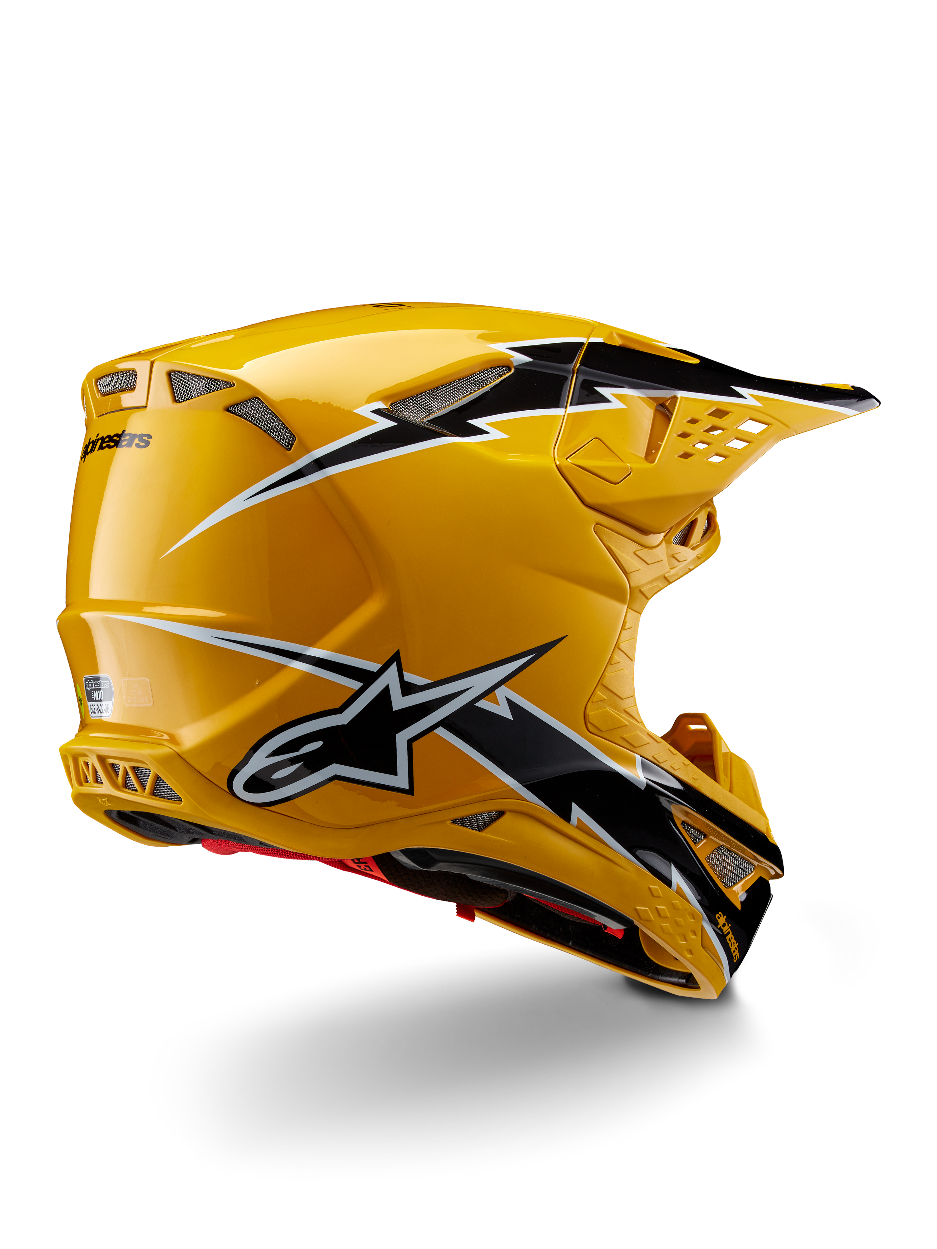 Casco Alpinestars Supertech M10 Ampress, casco de motocross, negro y amarillo brillante, con un acabado amarillo de alto brillo y gráficos estilo rayo en blanco y negro, vista trasera de tres cuartos que muestra la calota aerodinámica y puertos de ventilación integrados