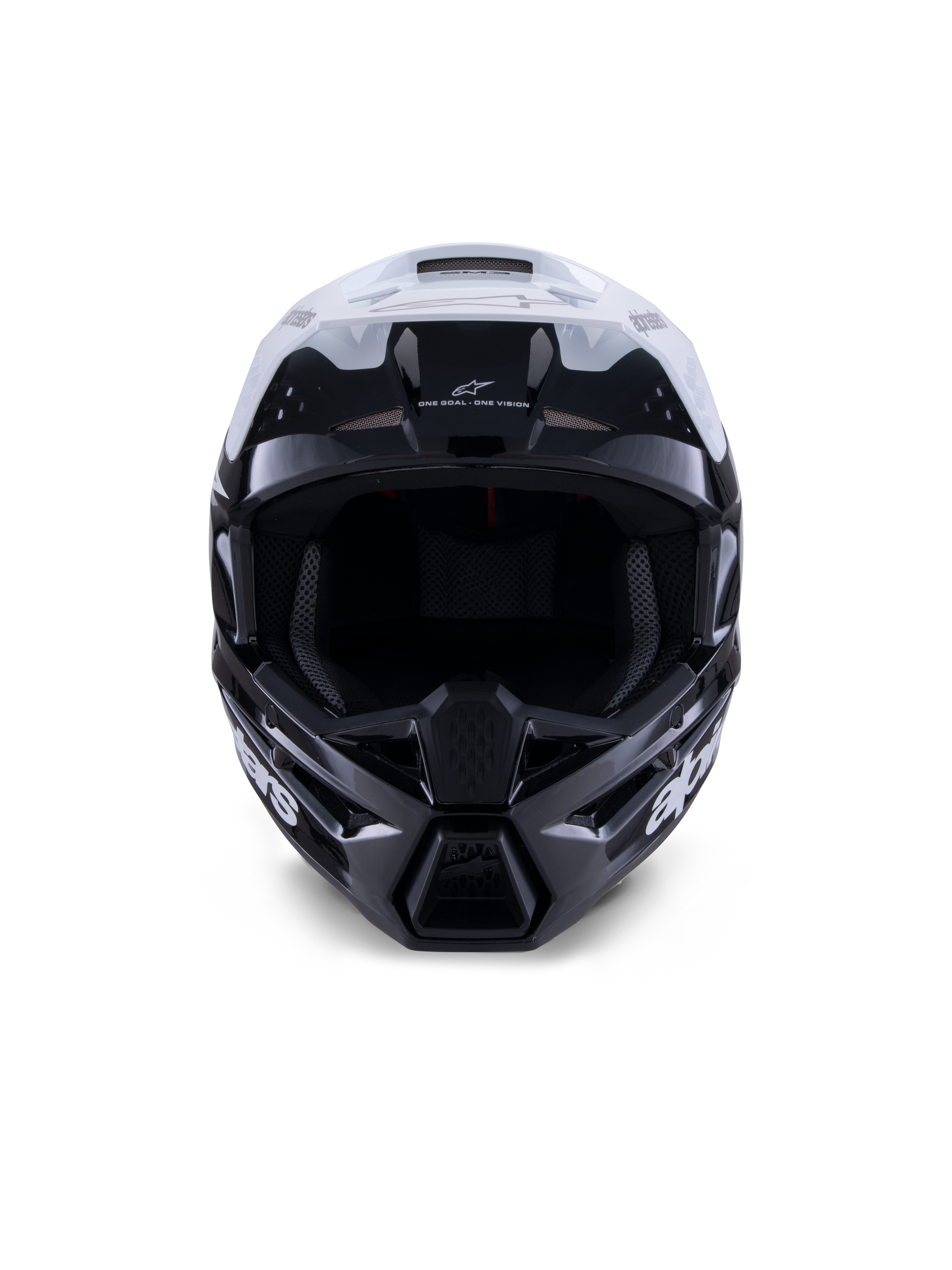 Casco Alpinestars S-M3 Radium, casco de motocross, negro, blanco y gris brillante, vista frontal, con un diseño de carcasa agresivo, visera blanca, mentonera negra y puertos de ventilación con forro de malla.