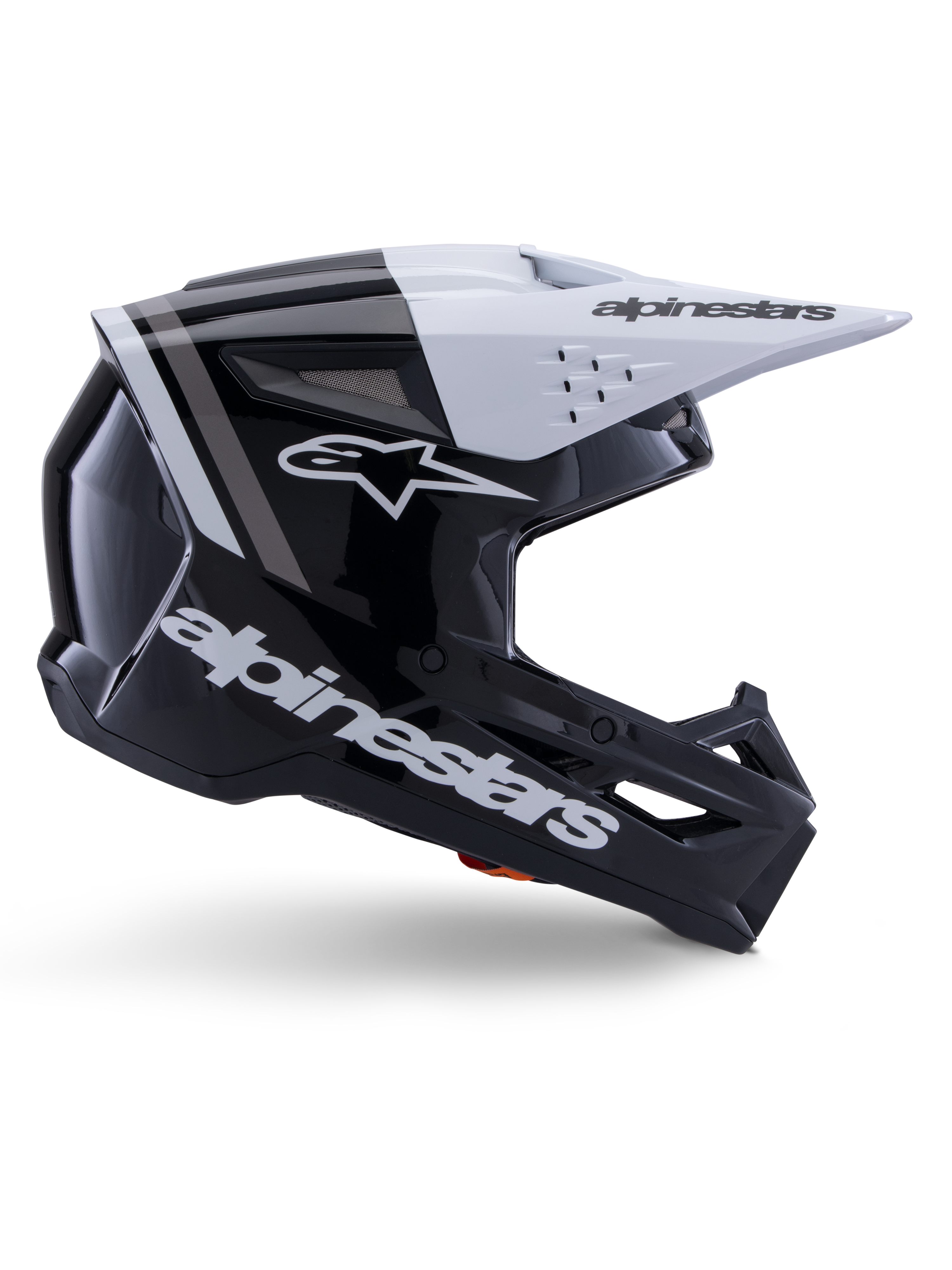 Casco Alpinestars S-M3 Radium, casco de motocross off-road, negro, blanco y gris brillante, con un diseño aerodinámico angular y puertos de ventilación, vista de perfil lateral, acabado brillante con franjas grises y visera blanca con el logotipo de Alpinestars