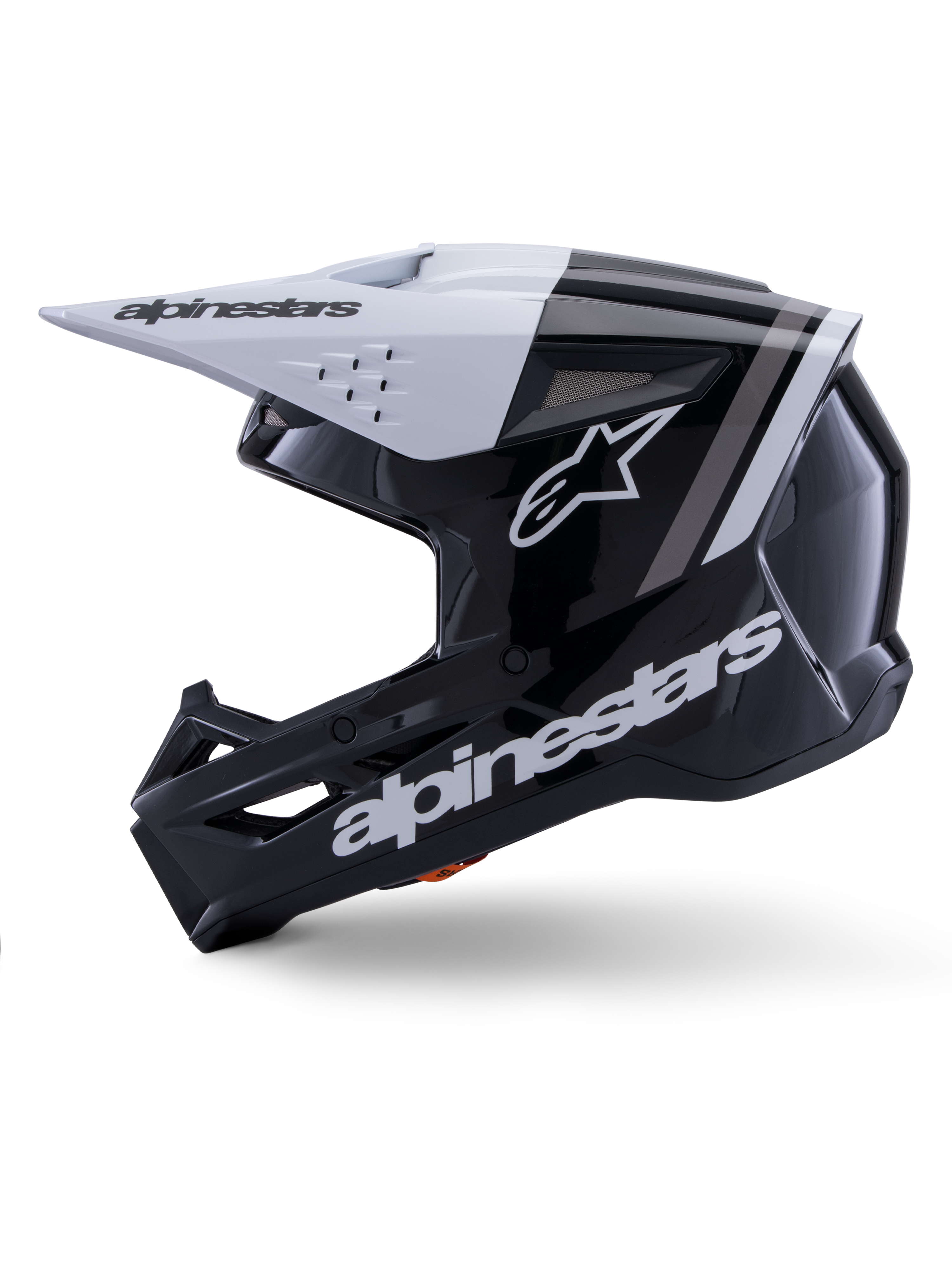 Casco Alpinestars S-M3 Radium ECE 22.06, vista de perfil lateral, acabado brillante en blanco y negro, franjas de competición grises, logotipo de Alpinestars blanco en el lateral y en la zona del mentón, diseño ventilado para motocross y enduro