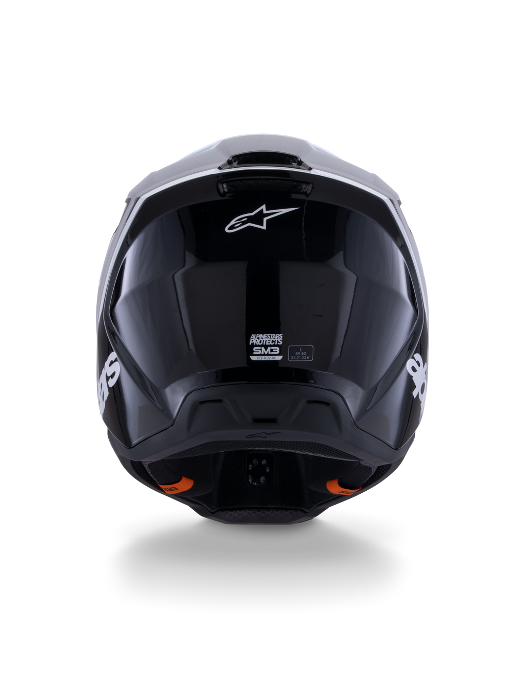 Casco Alpinestars S-M3 Radium ECE 22.06, casco de motocross, negro, blanco y gris brillante, vista posterior con acabado negro brillante, logotipo de estrella de Alpinestars, puertos de escape de ventilación y etiqueta de certificación ECE