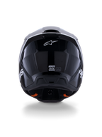 Casco Alpinestars S-M3 Radium ECE 22.06, casco de motocross, negro, blanco y gris brillante, vista posterior con acabado negro brillante, logotipo de estrella de Alpinestars, puertos de escape de ventilación y etiqueta de certificación ECE
