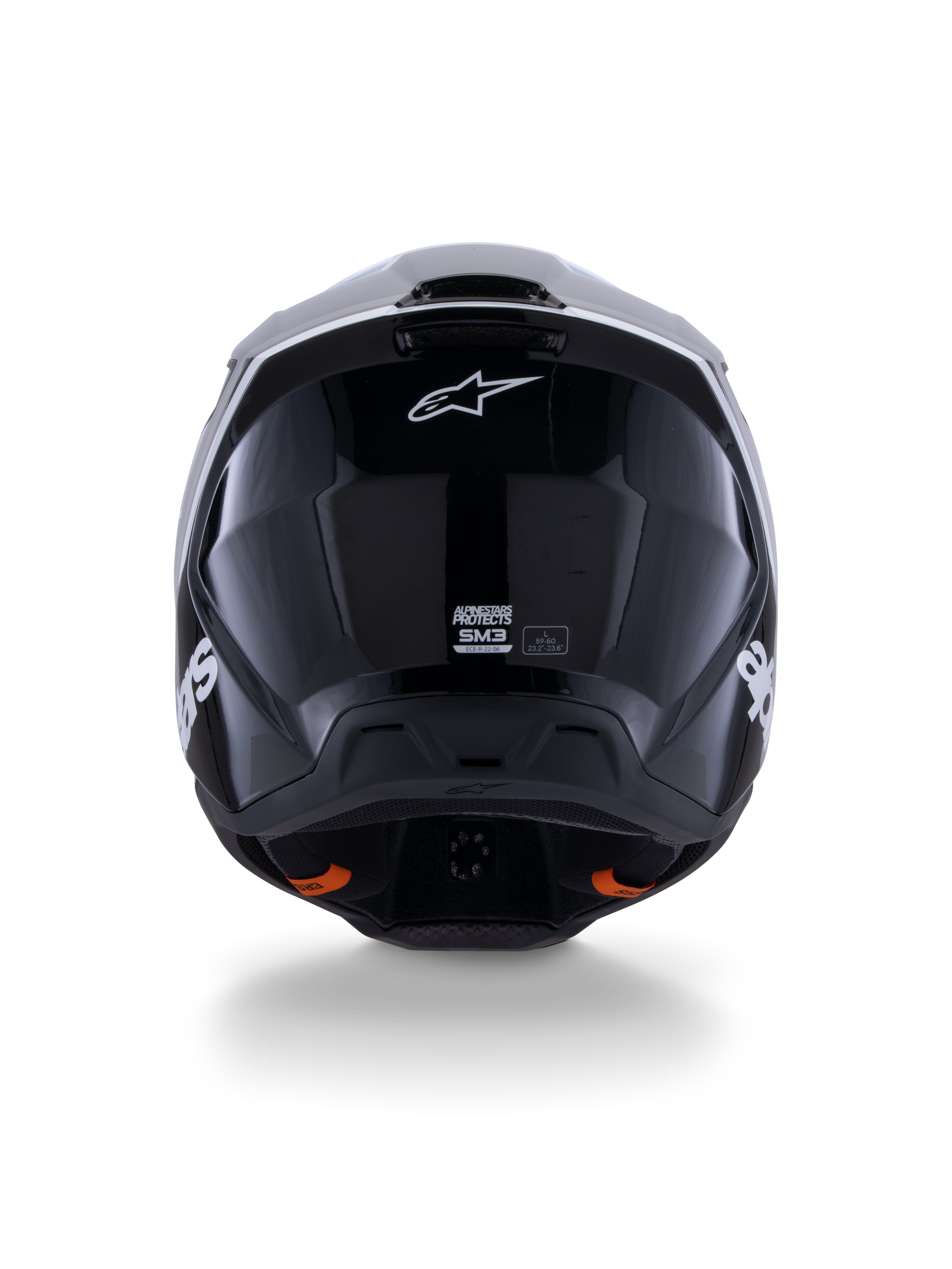 Casco Alpinestars S-M3 Radium ECE 22.06, casco de motocross, negro, blanco y gris brillante, vista posterior con acabado negro brillante, logotipo de estrella de Alpinestars, puertos de escape de ventilación y etiqueta de certificación ECE