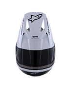 Casco Alpinestars S-M3 Radium, casco de motocross, negro, blanco y gris brillante, vista superior que muestra la visera blanca con el logotipo Astar negro y la marca SM3, acabado brillante con puertos de ventilación, protección de alto rendimiento para la cabeza en todoterreno