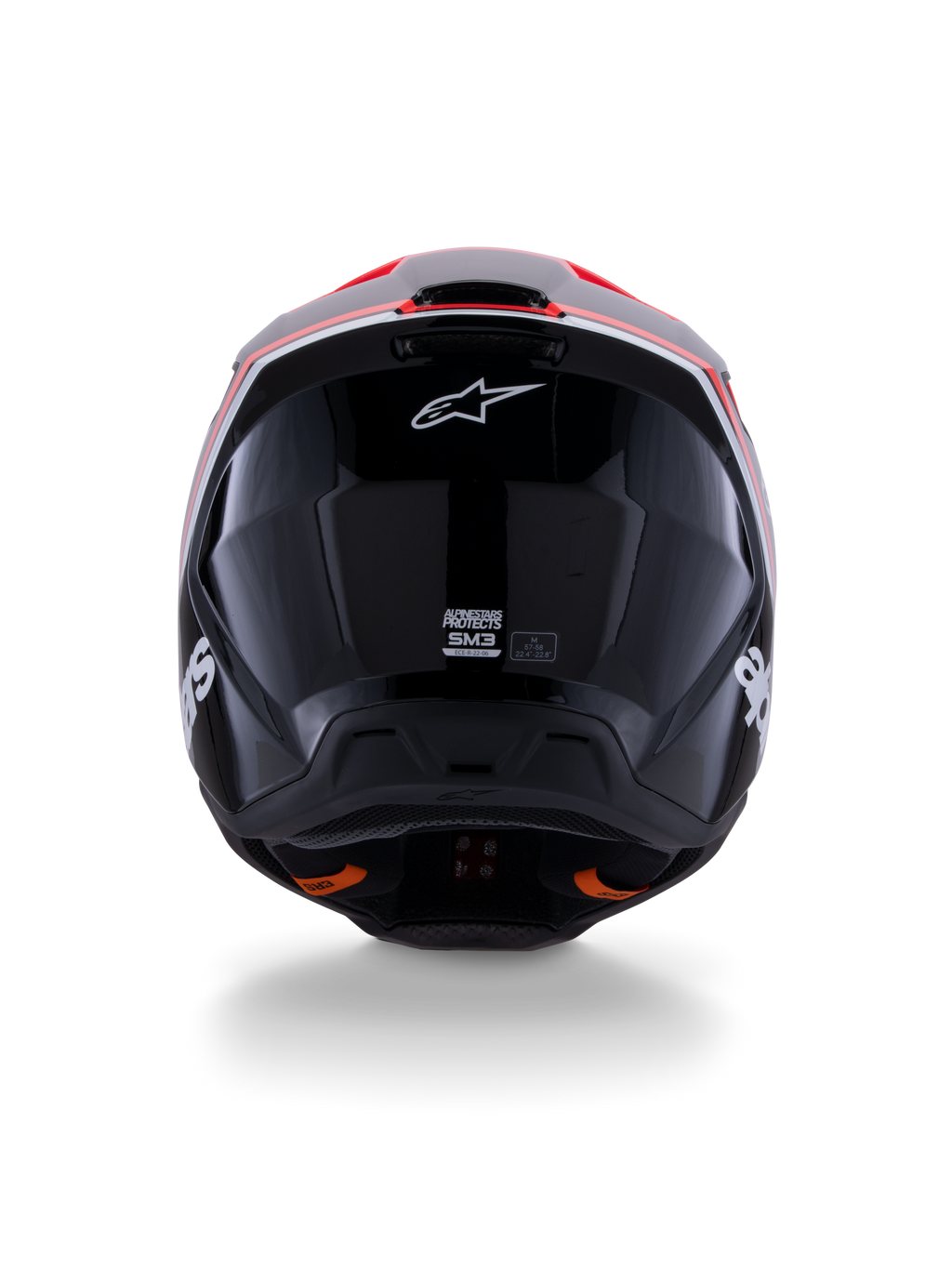 Alpinestars S-M3 Radium Helmet ECE 22.06, casco de motocross, negro brillante con detalles en rojo flúor y blanco, vista trasera que muestra el diseño aerodinámico de la calota, logotipo de la estrella blanca y etiquetas de certificación