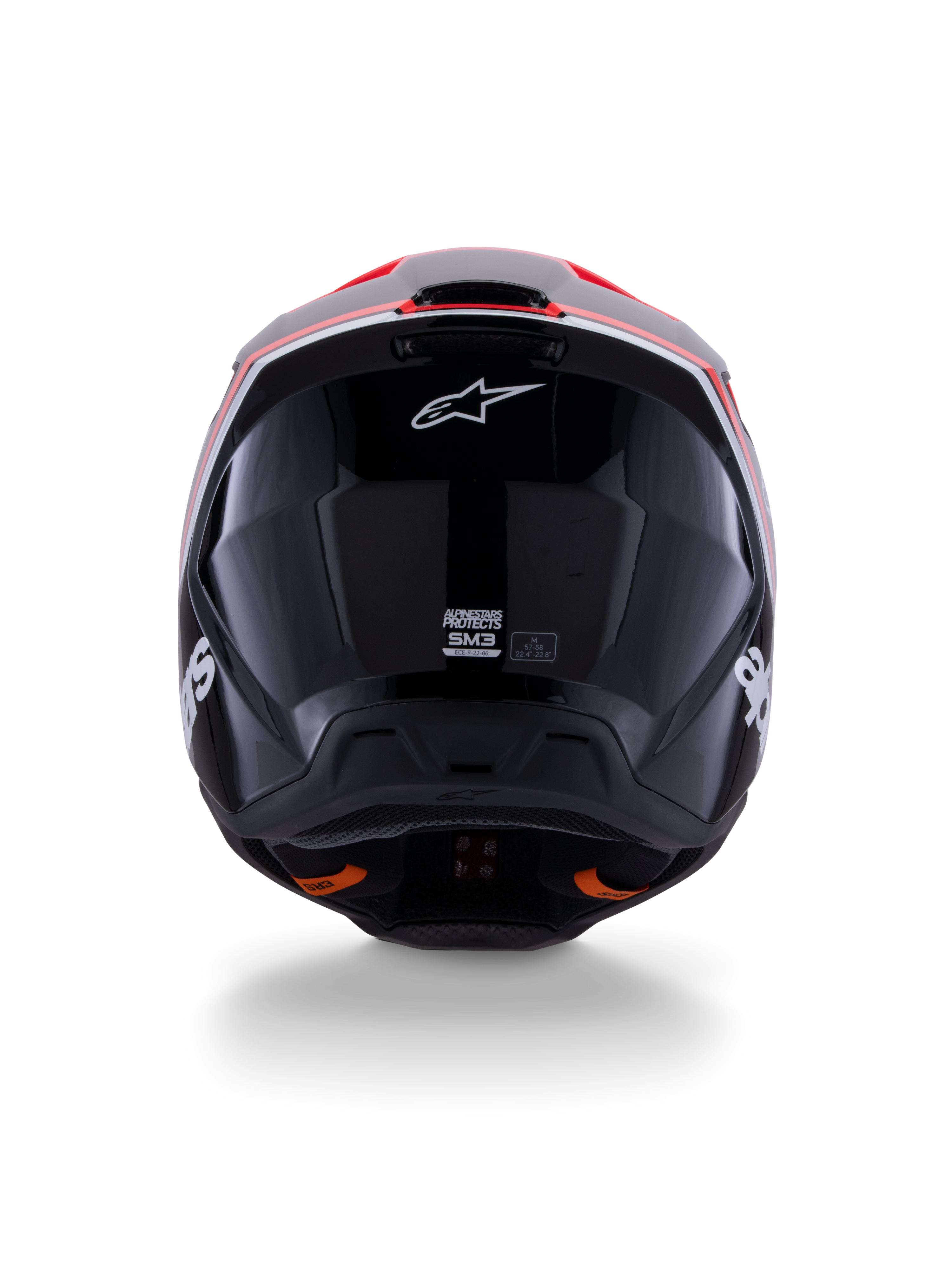Alpinestars S-M3 Radium Helmet ECE 22.06, casco de motocross, negro brillante con detalles en rojo flúor y blanco, vista trasera que muestra el diseño aerodinámico de la calota, logotipo de la estrella blanca y etiquetas de certificación