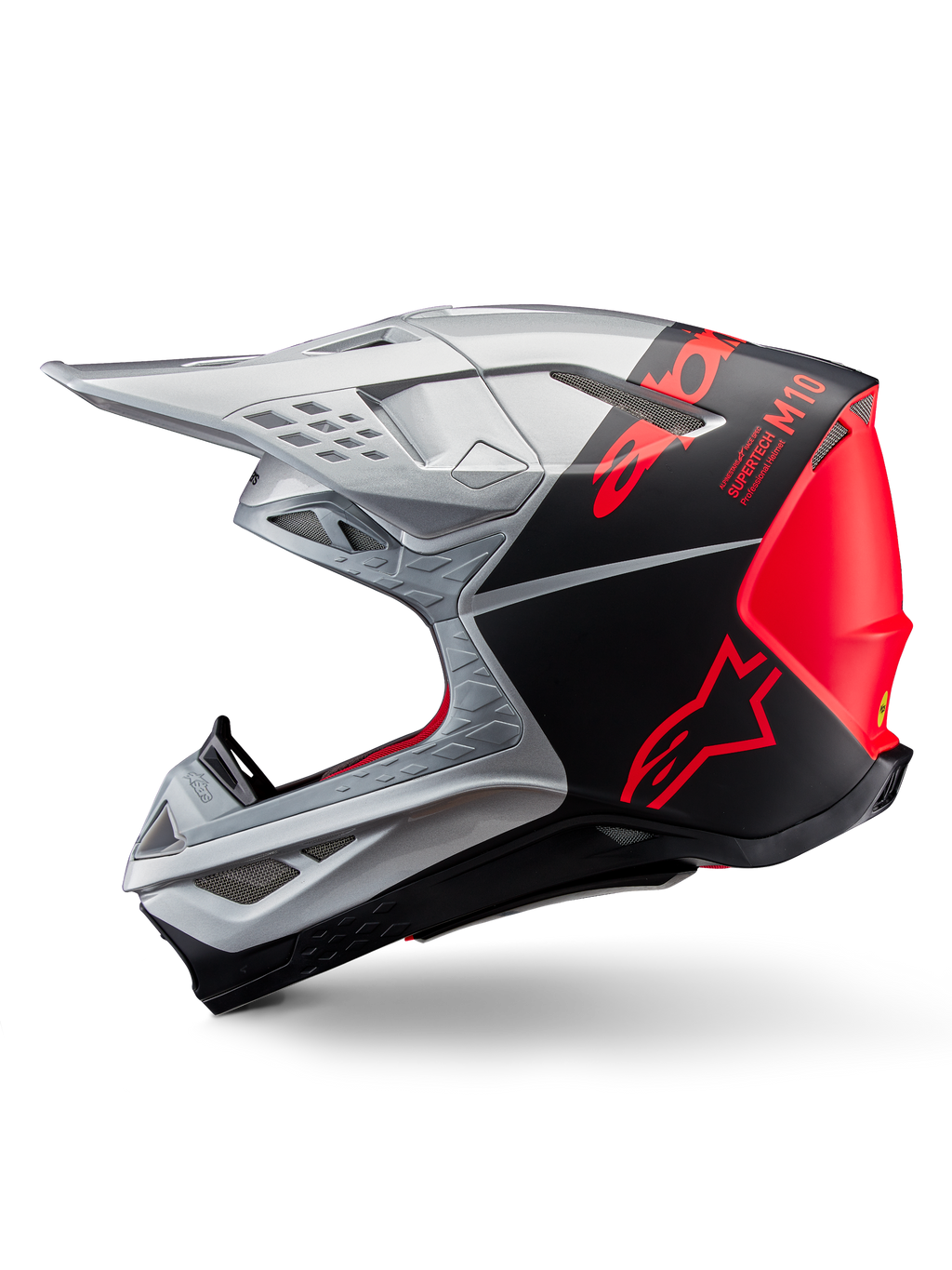 Casco Alpinestars Supertech M10 Flood, casco de motocross, plateado y negro con detalles en naranja fluorescente, perfil lateral, diseño aerodinámico elegante con puertos de ventilación, acabado mate y brillante, protección profesional para carreras off-road