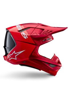 Casco Alpinestars Supertech M10 Flood, casco de motocross, rojo flúor y rojo mate y brillante, vista de perfil lateral con logotipos blancos, múltiples ventilaciones cubiertas de malla y diseño aerodinámico para carreras todoterreno