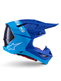 Alpinestars Supertech M10 Flood Helmet, Motocross Helmet, Metallic and Medium Blue with Black Carbon accents, side profile view, featuring a white logo, aerodynamic design with ventilation ports, carbon fiber texture details, professional off-road racing protection