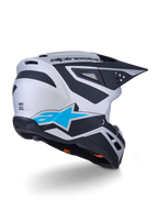Casco Alpinestars S-M3 Heat ECE 22.06, casco de motocross, plata, azul y negro mate, vista trasera con un gran logotipo de estrella azul y diseños angulares negros, carcasa aerodinámica con puertos de ventilación, protección de alto rendimiento para carreras off-road