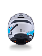 Casco Alpinestars S-M3 Heat, casco de motocross, color plata, azul y negro mate, vista trasera que muestra los logotipos de estrellas en azul brillante, acabado mate y puertos de ventilación integrados.