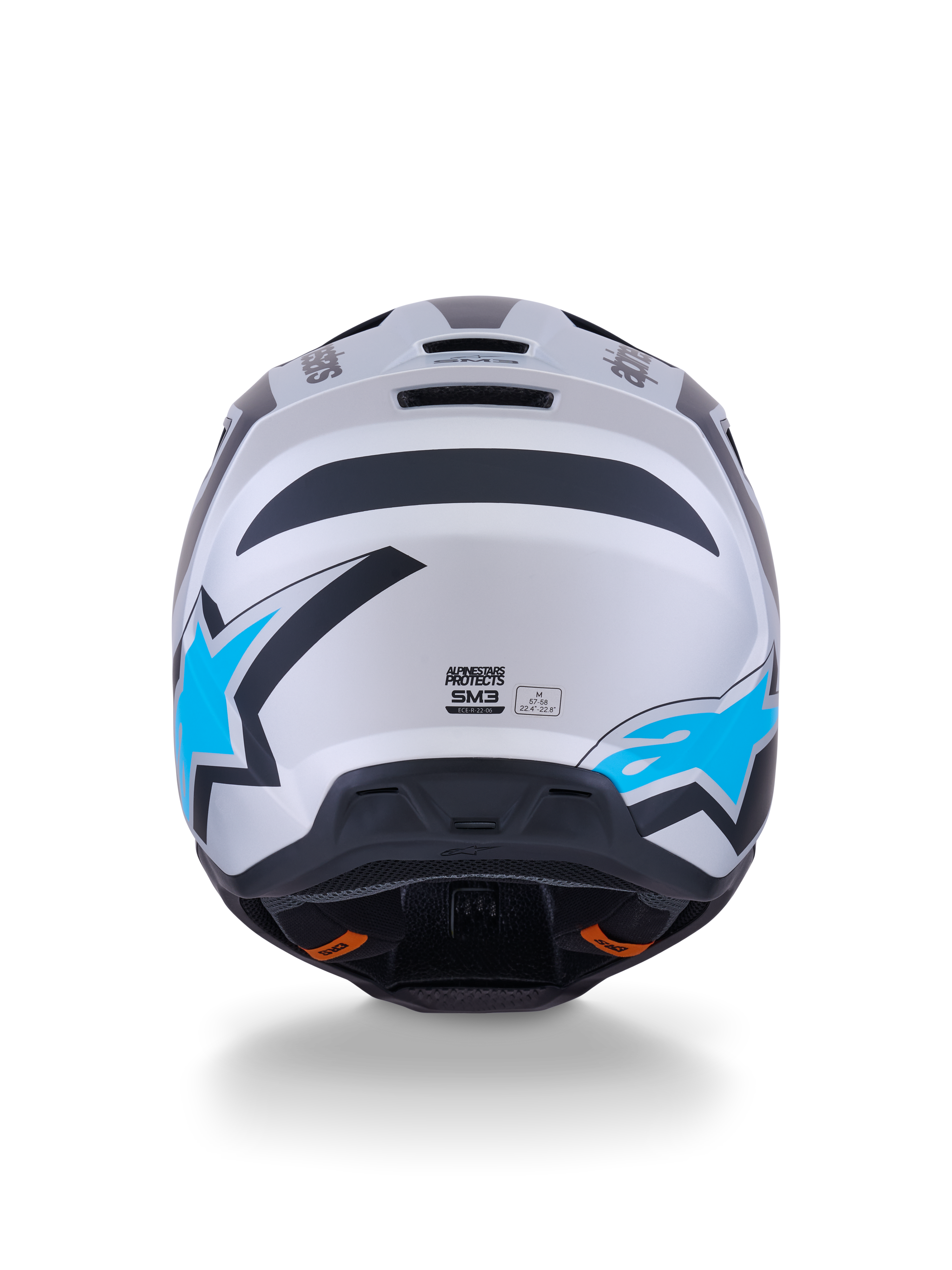Casco Alpinestars S-M3 Heat, casco de motocross, color plata, azul y negro mate, vista trasera que muestra los logotipos de estrellas en azul brillante, acabado mate y puertos de ventilación integrados.