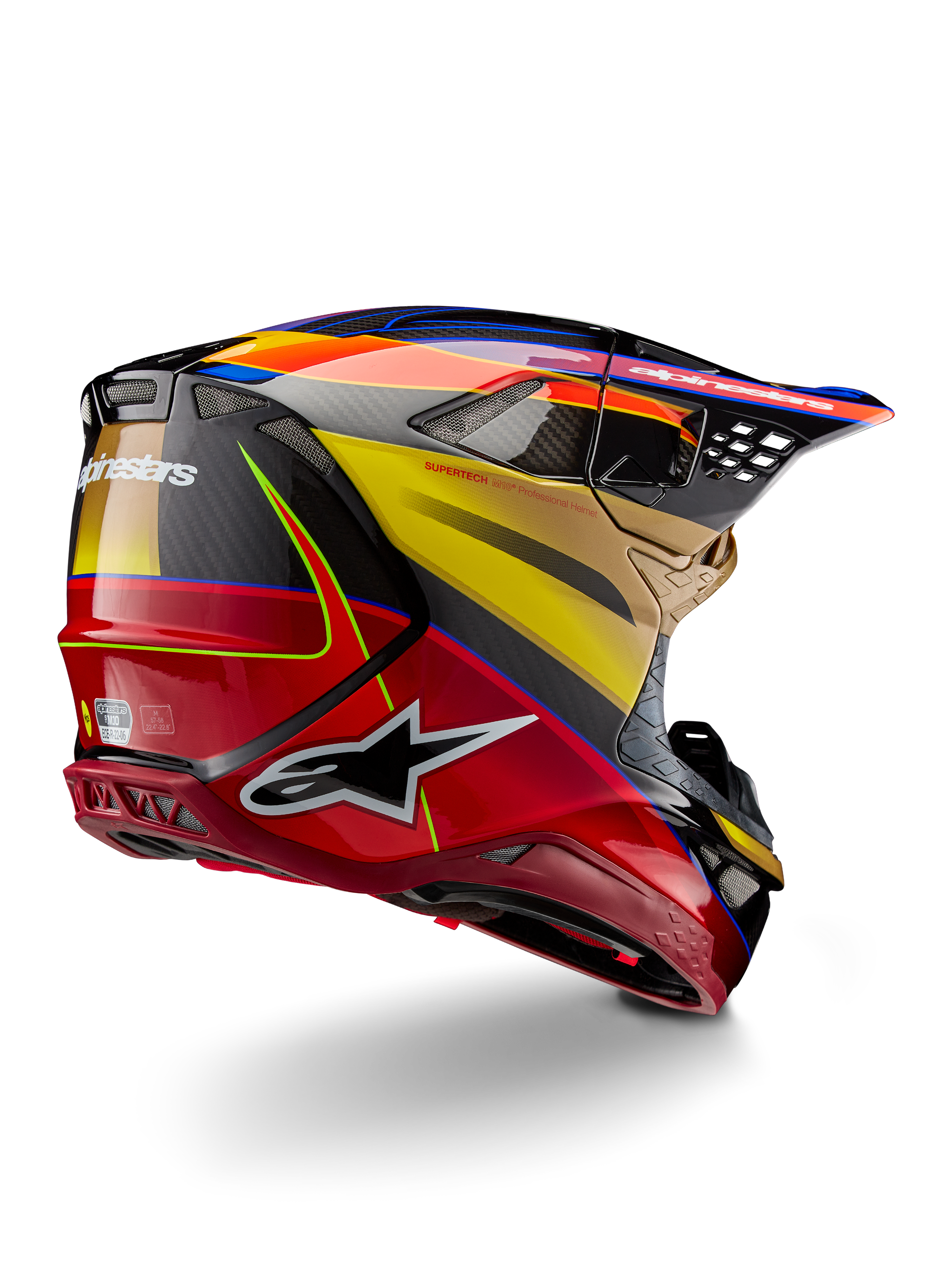 Casco Alpinestars Supertech M10 Era, casco de motocross, amarillo oro y rojo Rio brillante, vista trasera en tres cuartos que muestra la carcasa de fibra de carbono con gráficos en rojo y amarillo, detalles en azul, perfil aerodinámico con múltiples puertos de ventilación y el distintivo logotipo de Astar.