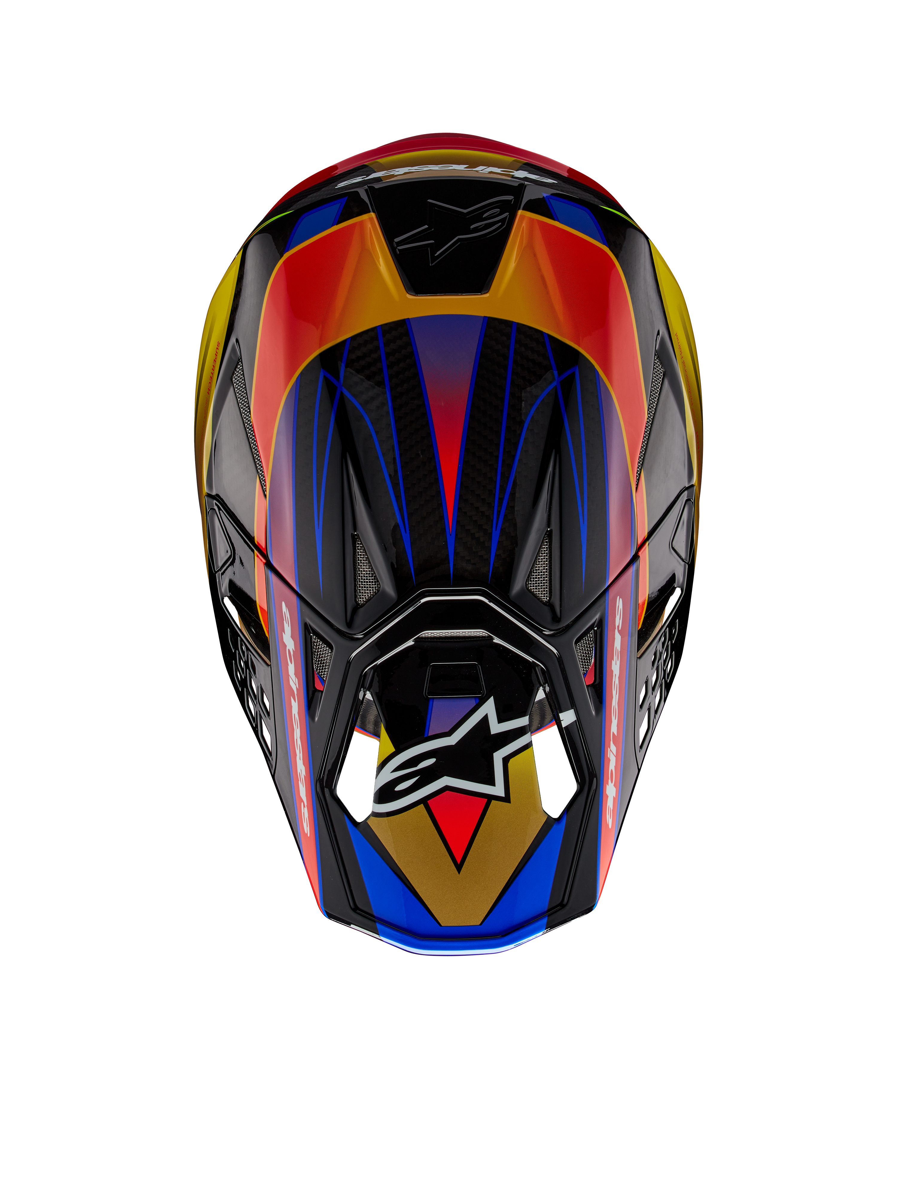 Casco Alpinestars Supertech M10 Era ECE, casco de motocross, Gold Yellow Rio Red Glossy, vista superior que muestra patrones geométricos vibrantes en azul y amarillo, acabado brillante con textura de fibra de carbono visible y logotipo de Alpinestars en la visera