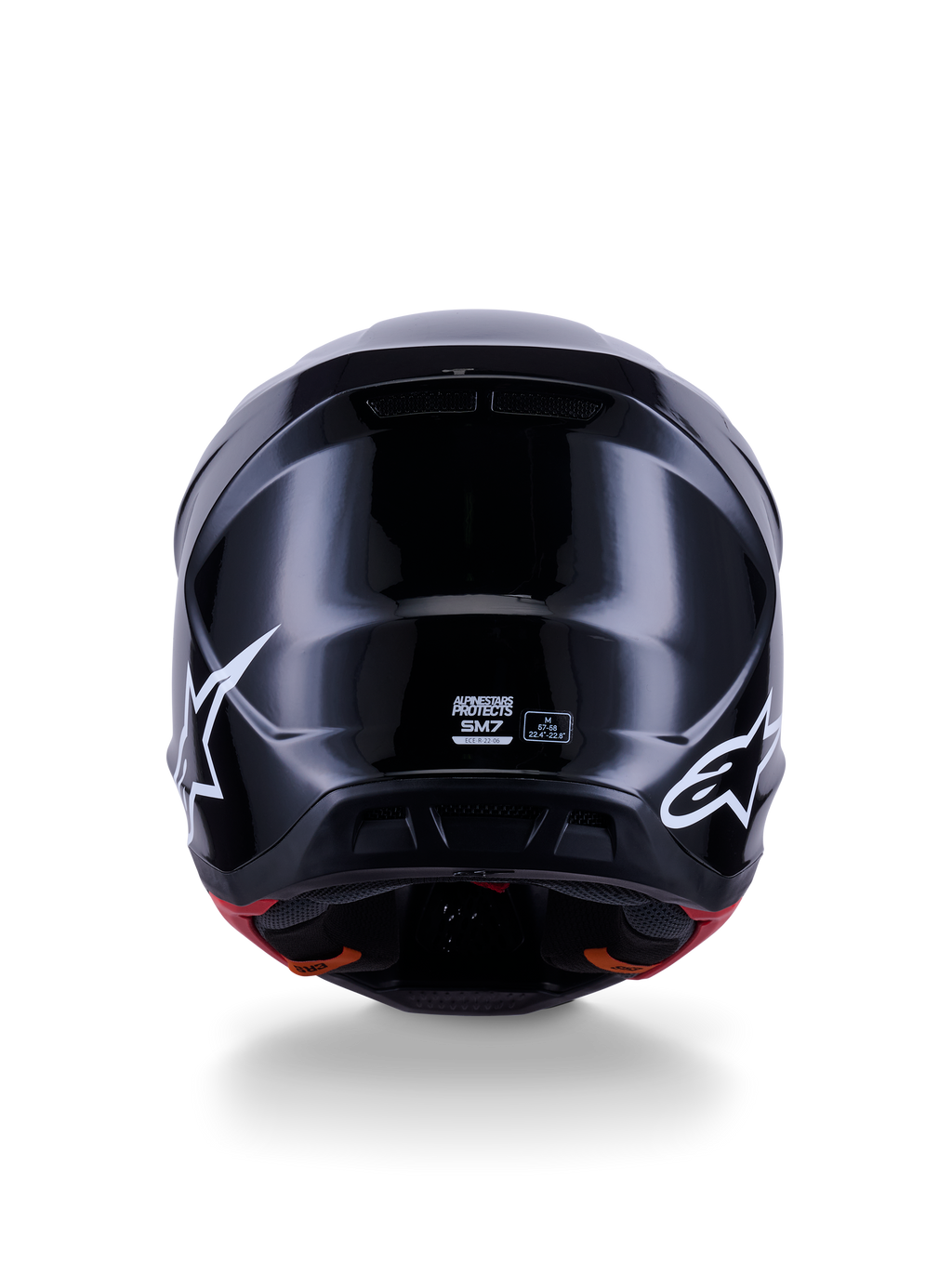 Alpinestars S-M7 Solid Helmet ECE 22.06, casco de motocross, negro brillante, vista trasera con logotipos de estrellas blancas, calota compuesta aerodinámica con acabado de alto brillo, etiquetas de certificación de seguridad y talla en el centro