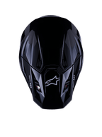 Alpinestars S-M7 Solid Helmet ECE 22.06, casco de motocross, negro brillante, vista superior que muestra la carcasa compuesta aerodinámica con el logo de Astars y la marca M7, diseño estilizado con puertos de ventilación para rendimiento en competición off-road