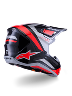 Alpinestars S-M7 Rise Helmet, casco de motocross, negro, plateado y rojo flúor brillante, vista trasera de tres cuartos, con el llamativo logotipo de la estrella en rojo y detalles plateados, calota aerodinámica con visera, protección profesional para carreras de motocross