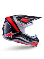 Casco Alpinestars S-M7 Rise, casco de motocross, negro, plateado y rojo flúor, vista lateral que muestra un diseño aerodinámico angular con visera y aberturas de ventilación, acabado brillante, serie Supertech M7