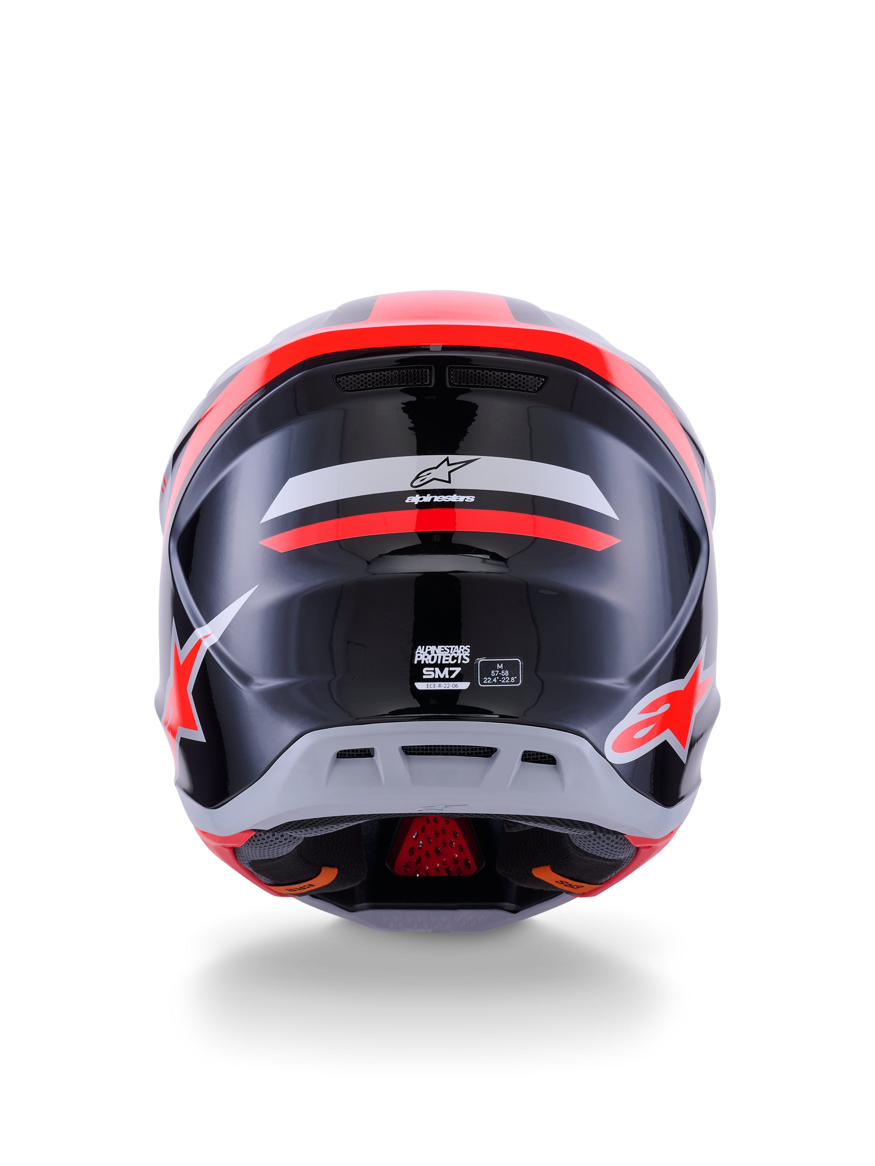 Casco Alpinestars S-M7 Rise ECE 22.06, casco de motocross, vista trasera, negro, plateado y rojo flúor brillante, con el logotipo de Alpinestars y la marca S-M7, acabado brillante con calota aerodinámica y detalles de ventilación