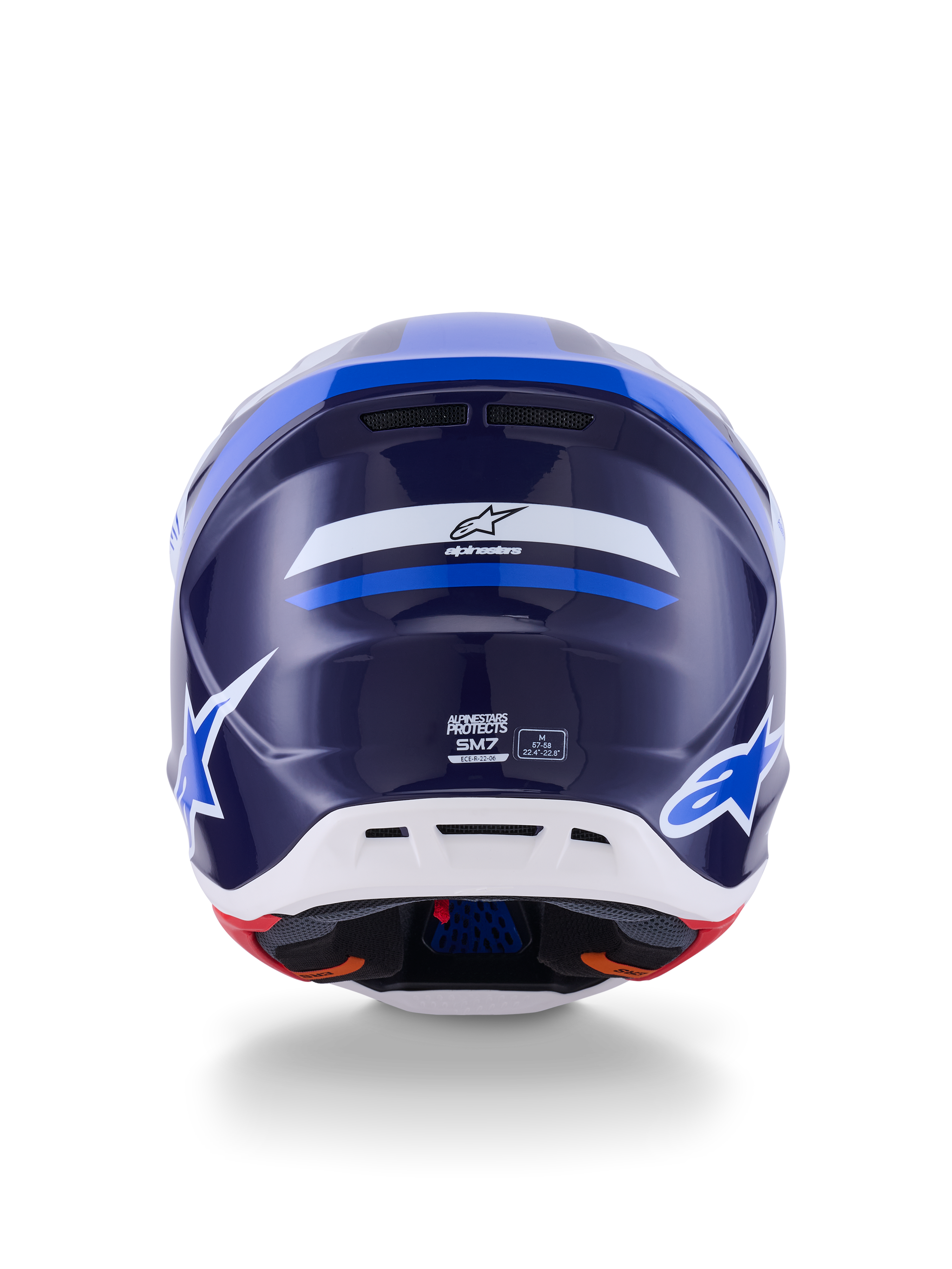 Casco Alpinestars S-M7 Rise, vista trasera, azul y blanco brillante, con el logotipo de Alpinestars y la marca SM7, carcasa de compuesto aerodinámico con sección inferior blanca y puertos de ventilación, protección para la cabeza de motocross de alto rendimiento