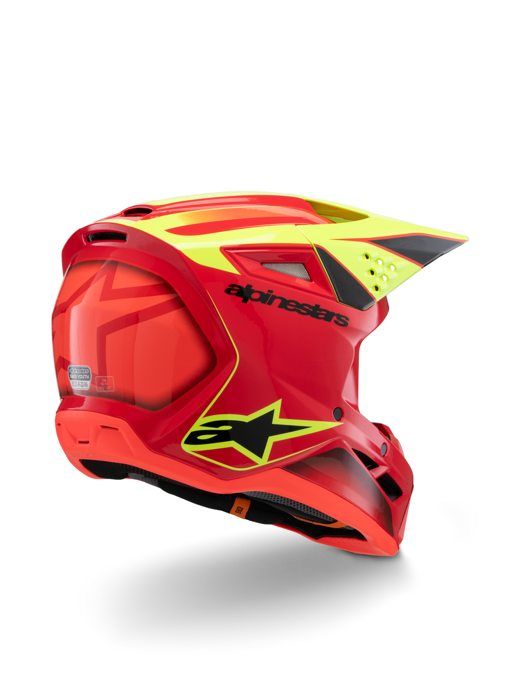 Casco Alpinestars S-M3 Youth Fray, rojo y amarillo flúor brillante, vista trasera en tres cuartos, con logotipos negros destacados y ventilaciones aerodinámicas, casco de motocross juvenil de alta visibilidad
